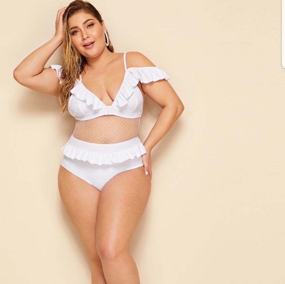 White one piece bathing suit Model is wearing a 1X